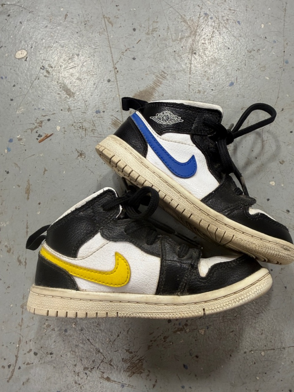 Nike Kids Black and White Sneakers with Blue Yellow, Red & Greenish Swooshes